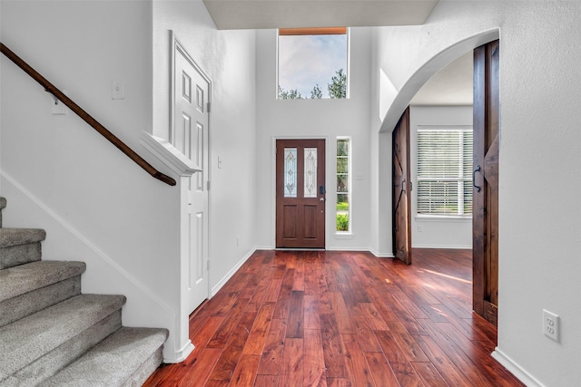 3502 Avalon Spring Ln, Spring, TX 77386 - foyer entrance with stairway, dark wood-type flooring, and arched walkways