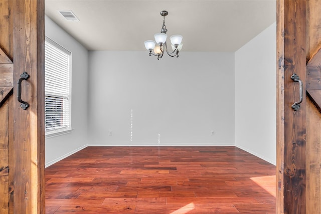 3502 Avalon Spring Ln, Spring, TX 77386 - unfurnished room with wood finished floors and a chandelier