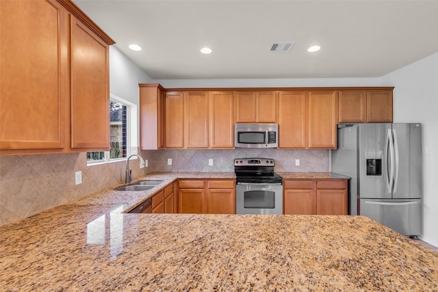 3502 Avalon Spring Ln, Spring, TX 77386 - kitchen featuring stainless steel appliances, light stone countertops, recessed lighting, and decorative backsplash