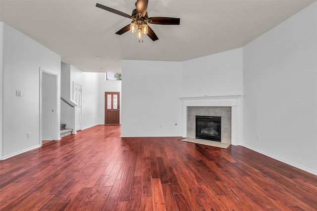 3502 Avalon Spring Ln, Spring, TX 77386 - unfurnished living room featuring hardwood / wood-style floors, a ceiling fan, stairs, and a fireplace