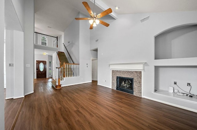 1123 Woodley Bnd, Sugar Land, TX 77479 - unfurnished living room with high vaulted ceiling, ceiling fan, wood finished floors, stairs, and a tiled fireplace