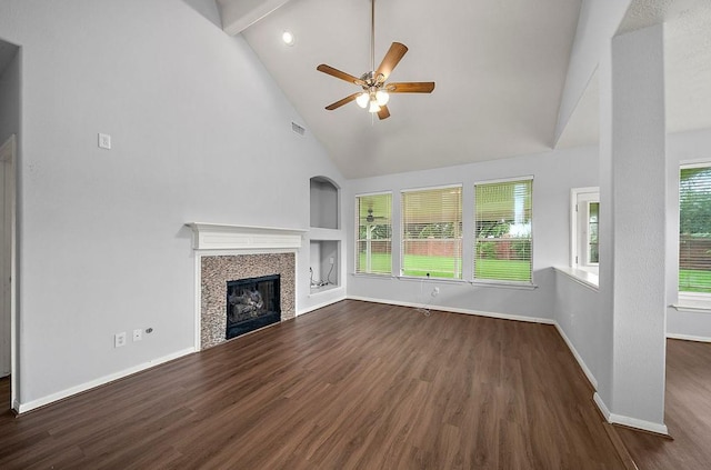 1123 Woodley Bnd, Sugar Land, TX 77479 - unfurnished living room with dark wood-style floors, high vaulted ceiling, a tiled fireplace, ceiling fan, and built in features
