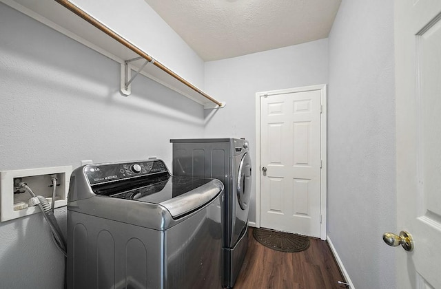 1123 Woodley Bnd, Sugar Land, TX 77479 - laundry room with washer and clothes dryer, dark wood-style floors, and a textured ceiling