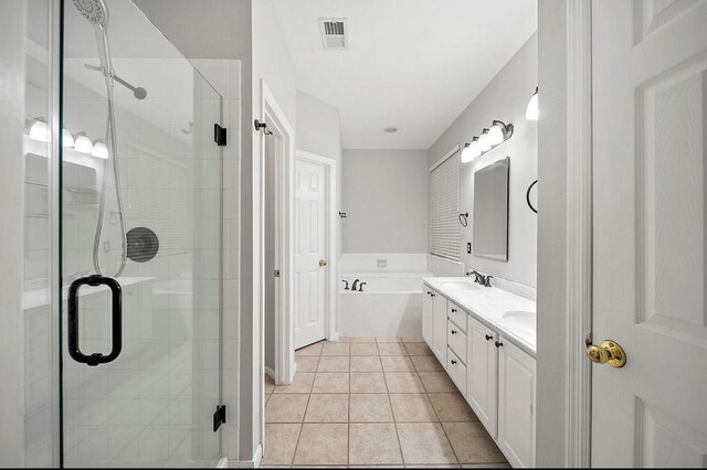 1123 Woodley Bnd, Sugar Land, TX 77479 - bathroom featuring double vanity, a stall shower, tile patterned floors, and a garden tub