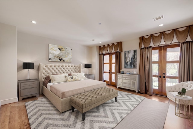 701 W Friar Tuck Ln, Houston, TX 77024 - bedroom featuring french doors, access to outside, light wood-style floors, and recessed lighting