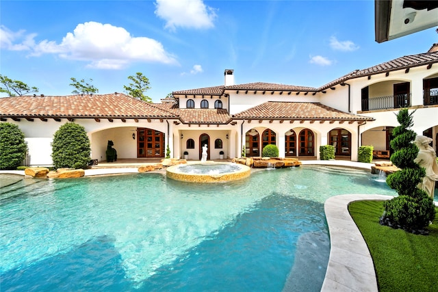 701 W Friar Tuck Ln, Houston, TX 77024 - view of swimming pool with a pool with connected hot tub