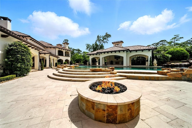 701 W Friar Tuck Ln, Houston, TX 77024 - view of home's community with a fire pit, a patio area, and a swimming pool