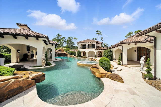 701 W Friar Tuck Ln, Houston, TX 77024 - view of pool featuring a pool with connected hot tub and a patio area