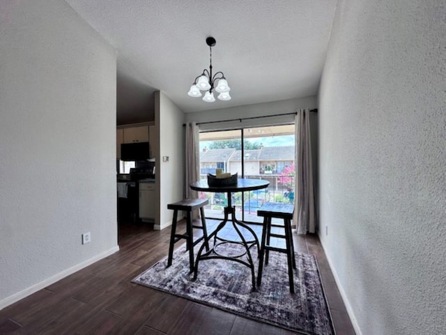 2211 S Kirkwood Rd Unit 35, Houston, TX 77077 - dining area with a textured wall, a chandelier, dark wood finished floors, vaulted ceiling, and a textured ceiling