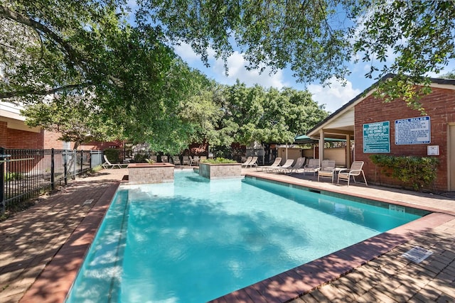 2211 S Kirkwood Rd Unit 35, Houston, TX 77077 - community pool featuring a patio