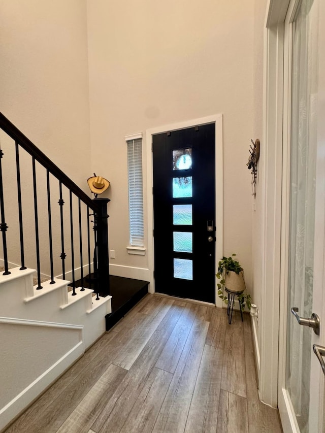 15814 Weston Ridge Dr, Humble, TX 77346 - foyer entrance with hardwood / wood-style flooring, stairs, and a high ceiling