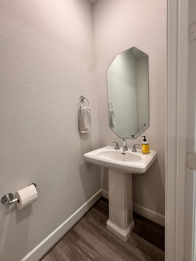 15814 Weston Ridge Dr, Humble, TX 77346 - bathroom featuring wood finished floors and baseboards