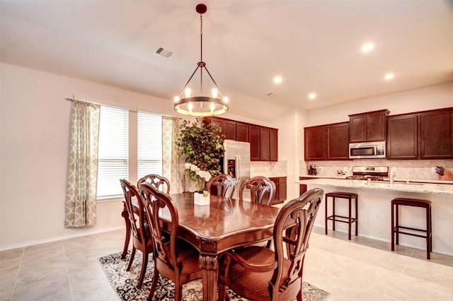 12223 Antilles Ln, Conroe, TX 77304 - dining area featuring a chandelier, recessed lighting, and light tile patterned floors