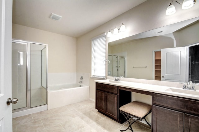 12223 Antilles Ln, Conroe, TX 77304 - bathroom with a stall shower, a garden tub, double vanity, and tile patterned floors