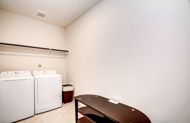 12223 Antilles Ln, Conroe, TX 77304 - laundry room with washing machine and dryer and light tile patterned floors
