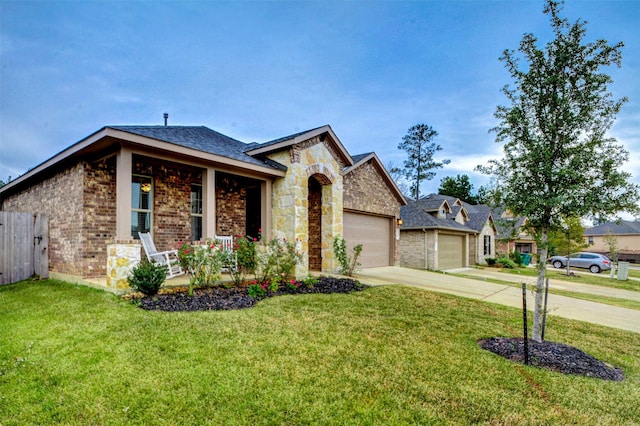 12223 Antilles Ln, Conroe, TX 77304 - view of front of home featuring brick siding, covered porch, concrete driveway, and stone siding