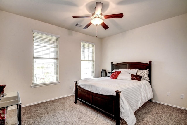 12223 Antilles Ln, Conroe, TX 77304 - carpeted bedroom with baseboards and ceiling fan