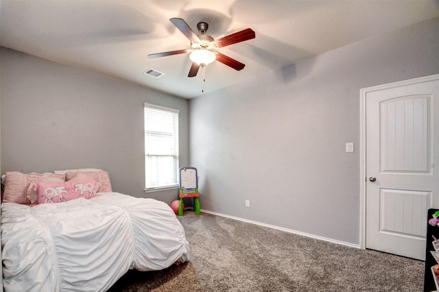 12223 Antilles Ln, Conroe, TX 77304 - carpeted bedroom with baseboards and a ceiling fan