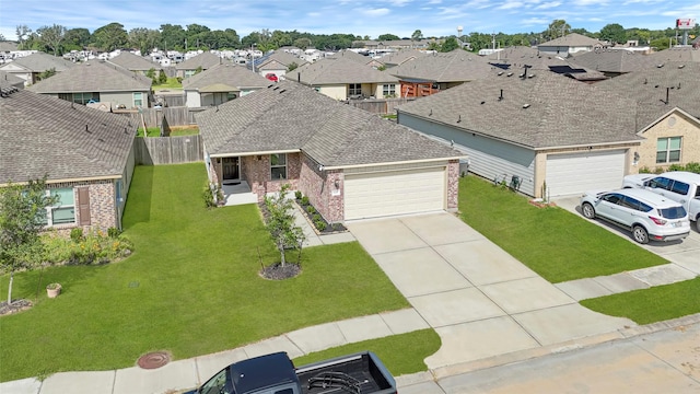 638 E Fairway Lake Dr, Alvin, TX 77511 - view of front of home featuring brick siding, roof with shingles, an attached garage, a residential view, and concrete driveway