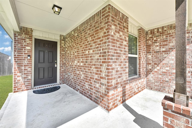 638 E Fairway Lake Dr, Alvin, TX 77511 - doorway to property with brick siding and covered porch