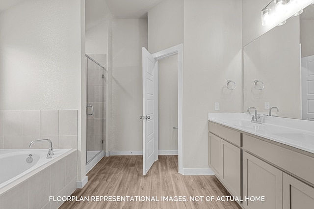 20638 Draper Rd, Tomball, TX 77377 - full bath with wood finished floors, a shower stall, double vanity, and a bath