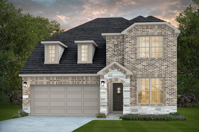 18222 Velaris Way, Tomball, TX 77377 - view of front of home with driveway, stone siding, brick siding, and a lawn