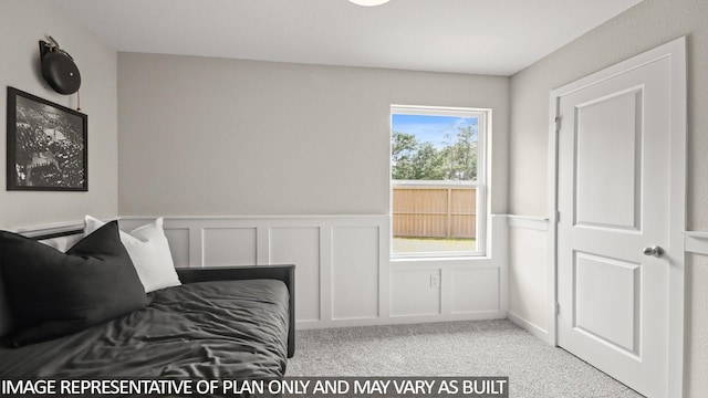 23748 Patchouli Terrace Dr, Splendora, TX 77372 - bedroom featuring wainscoting, carpet, and a decorative wall