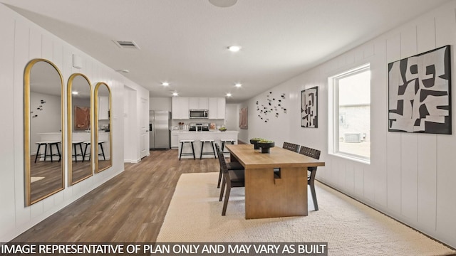 23748 Patchouli Terrace Dr, Splendora, TX 77372 - dining space with wood finished floors and recessed lighting