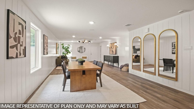 23748 Patchouli Terrace Dr, Splendora, TX 77372 - dining space with wood finished floors, a chandelier, and recessed lighting