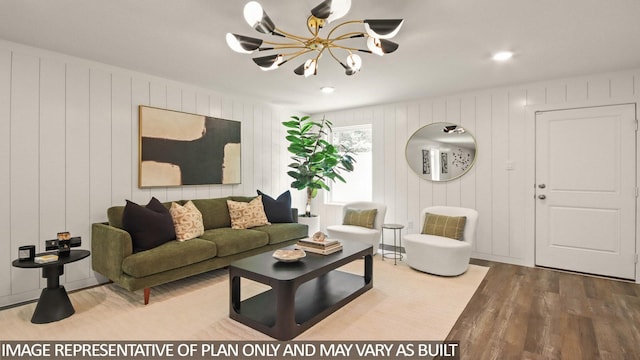 23748 Patchouli Terrace Dr, Splendora, TX 77372 - living room featuring a chandelier, wood finished floors, and a decorative wall