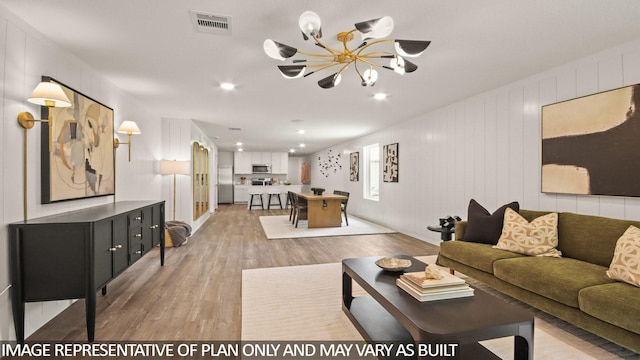 23748 Patchouli Terrace Dr, Splendora, TX 77372 - living room with light wood-style floors, a chandelier, and recessed lighting