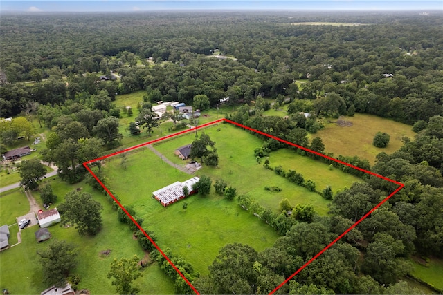 27093 Frye Rd, Splendora, TX 77372 - aerial view of property's location with property parcel outlined and a heavily wooded area