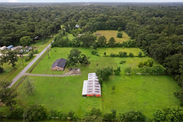 27093 Frye Rd, Splendora, TX 77372 - view of rural area featuring a heavily wooded area