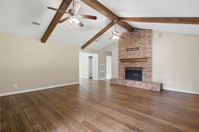 27093 Frye Rd, Splendora, TX 77372 - unfurnished living room with ceiling fan, wood finished floors, and a brick fireplace
