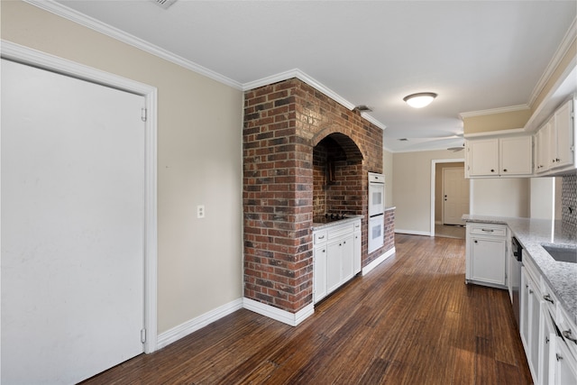 27093 Frye Rd, Splendora, TX 77372 - kitchen featuring white cabinets, dark wood-style flooring, and ornamental molding