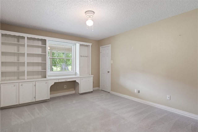 27093 Frye Rd, Splendora, TX 77372 - unfurnished office featuring light colored carpet and a textured ceiling