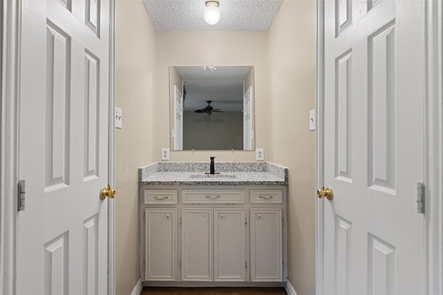 27093 Frye Rd, Splendora, TX 77372 - bathroom featuring a textured ceiling and vanity