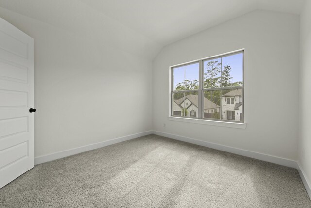 16710 Yaklin Meadow Ct, Humble, TX 77346 - spare room with vaulted ceiling and carpet floors