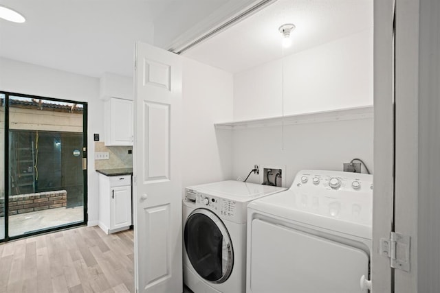 9901 Sharpcrest St Unit K-3, Houston, TX 77036 - laundry room with washing machine and clothes dryer and light wood-type flooring