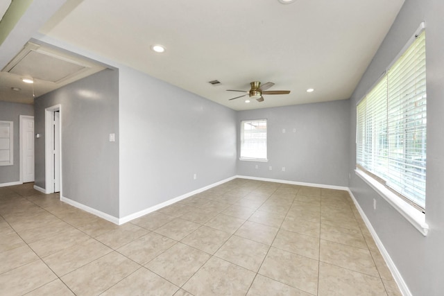 743 Eastlake St, Houston, TX 77034 - empty room featuring a ceiling fan, light tile patterned floors, attic access, and recessed lighting