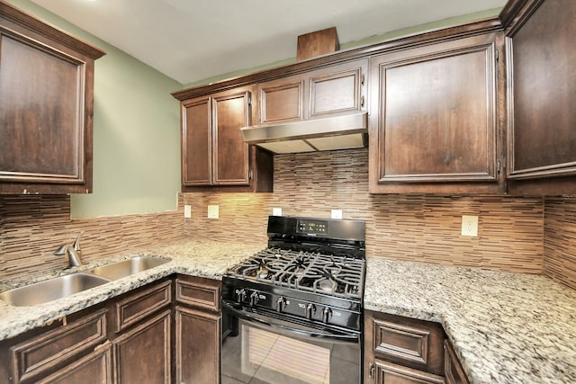 743 Eastlake St, Houston, TX 77034 - kitchen featuring black range with gas stovetop, under cabinet range hood, backsplash, dark brown cabinets, and light stone counters