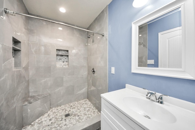 743 Eastlake St, Houston, TX 77034 - full bathroom with tiled shower, vanity, and recessed lighting