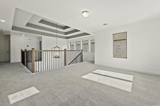 16738 Yaklin Meadow Ct, Humble, TX 77346 - spare room featuring carpet floors, a raised ceiling, and attic access