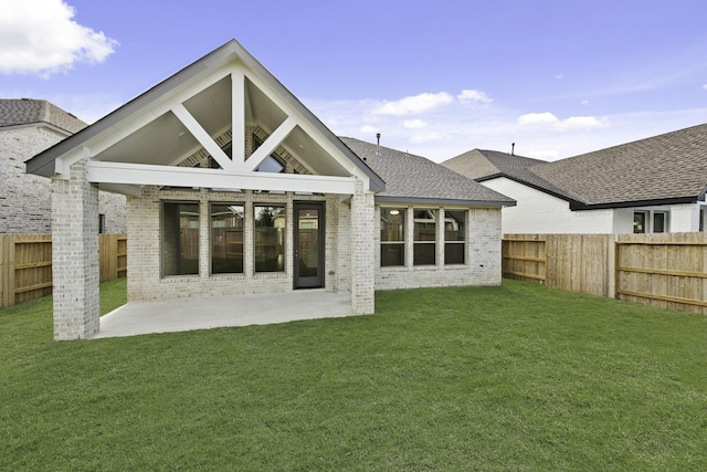 16738 Yaklin Meadow Ct, Humble, TX 77346 - rear view of house with brick siding, a fenced backyard, a patio, and roof with shingles