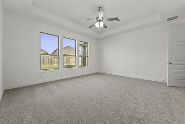 16738 Yaklin Meadow Ct, Humble, TX 77346 - carpeted spare room with a tray ceiling and a ceiling fan