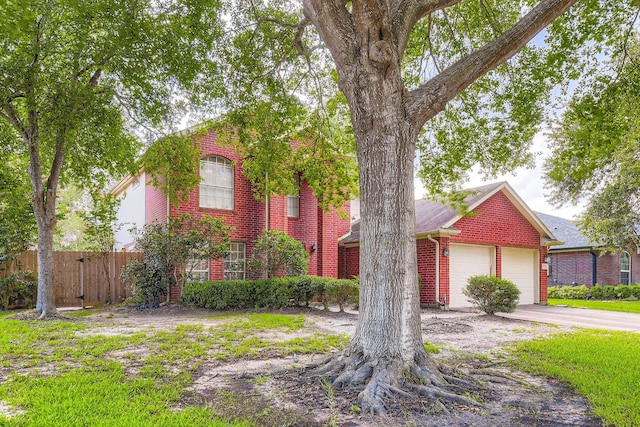 16307 Mango Ridge Ct, Humble, TX 77396 - view of front of home featuring brick siding, driveway, and a garage