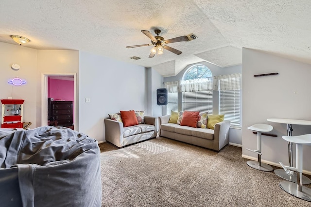 16307 Mango Ridge Ct, Humble, TX 77396 - living room featuring a ceiling fan, a textured ceiling, carpet floors, and vaulted ceiling