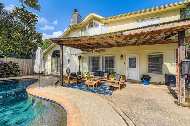 16307 Mango Ridge Ct, Humble, TX 77396 - rear view of property featuring a patio, outdoor lounge area, a ceiling fan, and a chimney