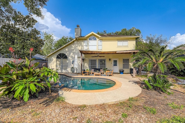 16307 Mango Ridge Ct, Humble, TX 77396 - back of property with a ceiling fan, a patio, and a chimney