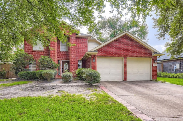 16307 Mango Ridge Ct, Humble, TX 77396 - traditional home with an attached garage, brick siding, and driveway